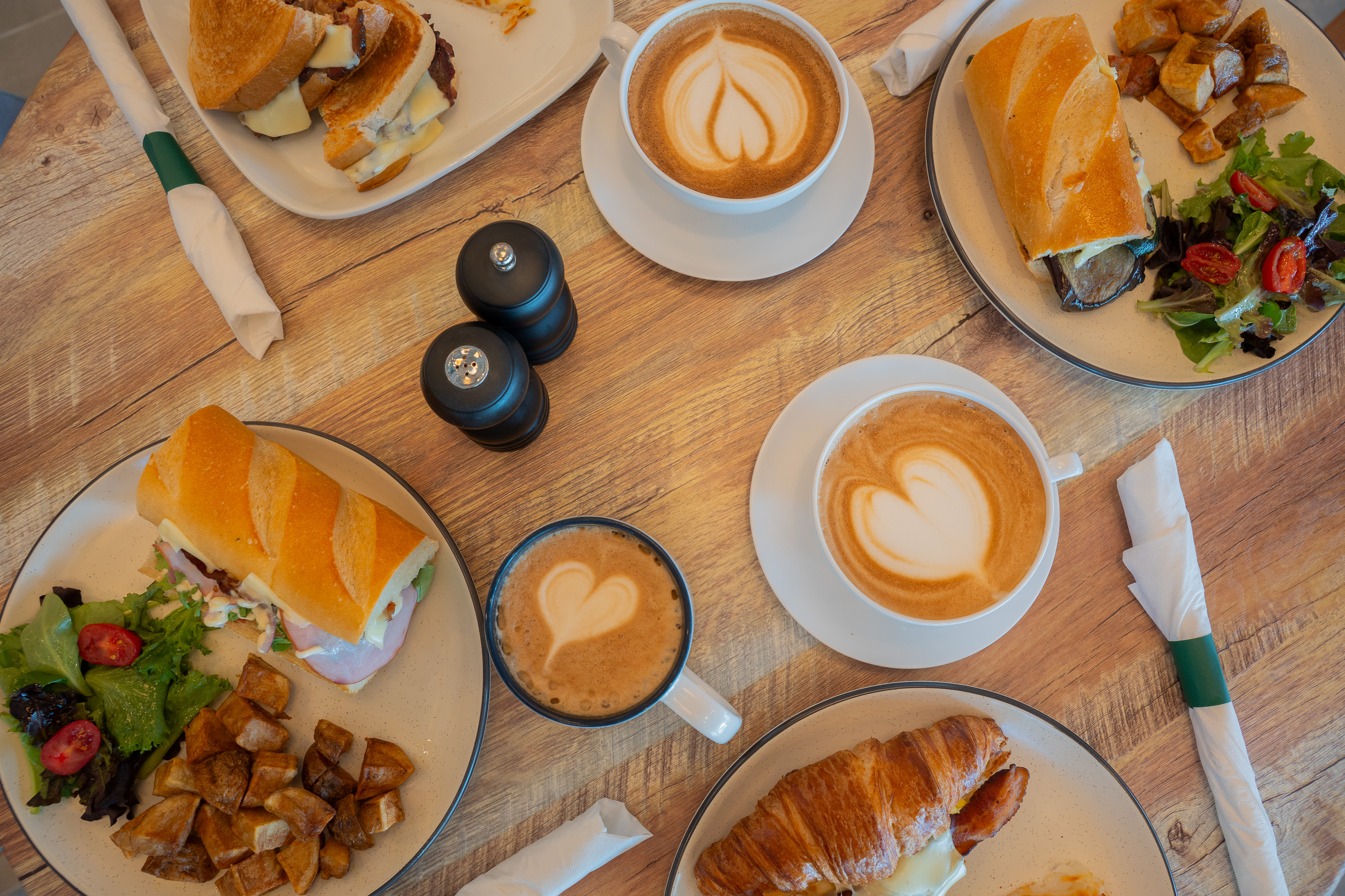 Breakfast spread with lattes at Cafe Marquise